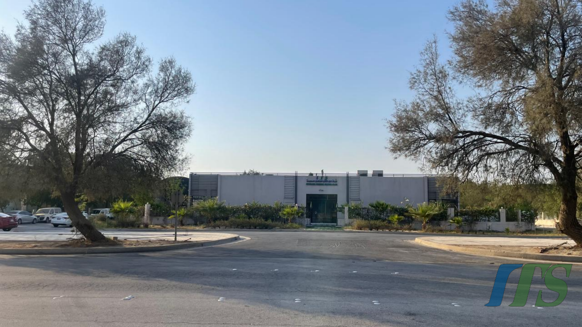 ITS office building and entrance in Jubail, surrounded by trees